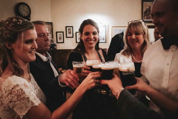 Friends and guests sharing pints of Guinness/beer