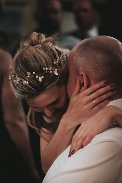 Bride and groom hug/embrace