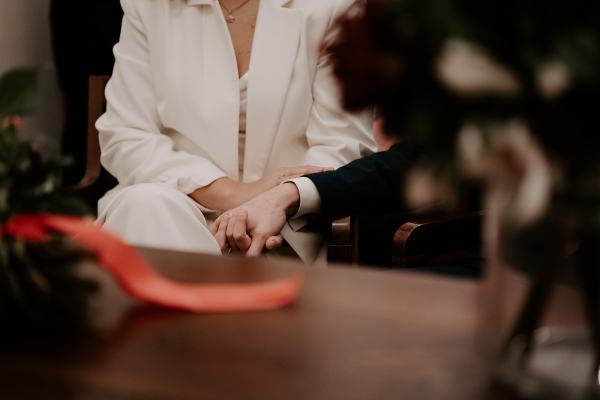 Focus on bride and grooms hands during ceremony