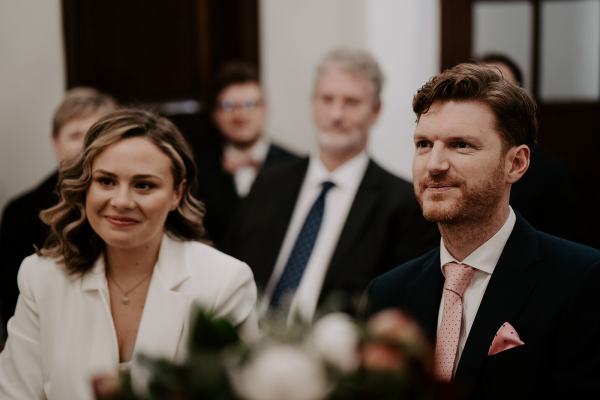 Bride and groom smile during ceremony