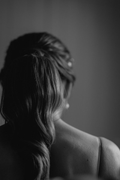 Shot of brides hair from behind earring and headband detail