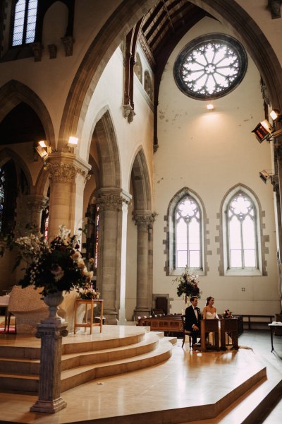 Shot of alter interior cathedral and tinted window frames in background