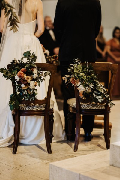 Close up of chair detail bride and groom at alter