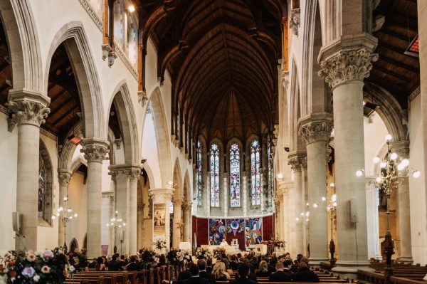 View of cathedral and guests seated before ceremony