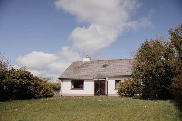 Country house surrounded by trees grass