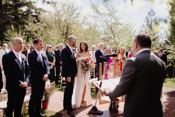 Bride groom and celebrant at alter