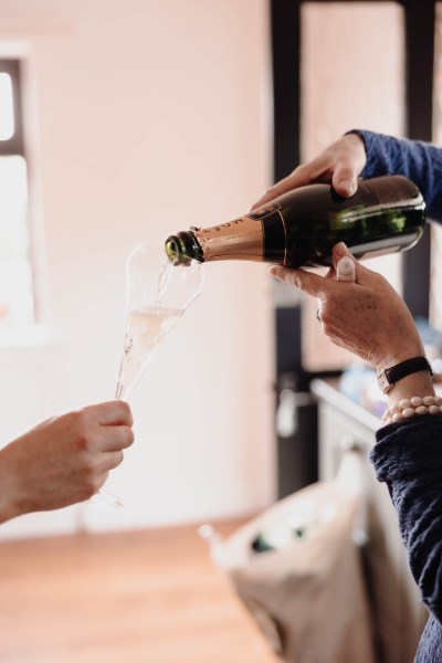 Champagne/prosecco being poured into glass