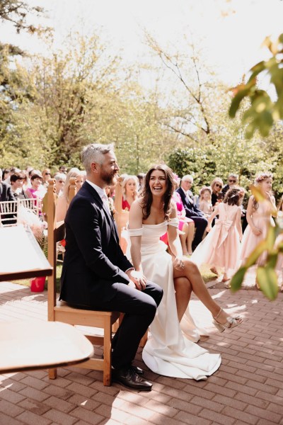 Bride and groom are seated during ceremony