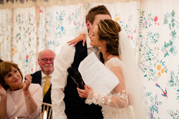 Bride and groom hug and embrace