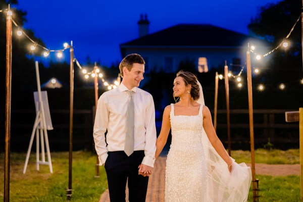 Couple evening shot on pathway lights in background