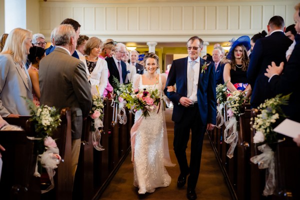 Father of the bride walks her down the aisle