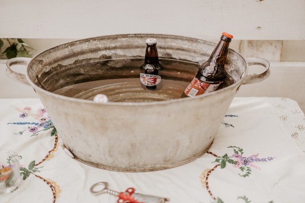 Bottles of beer inside large basin