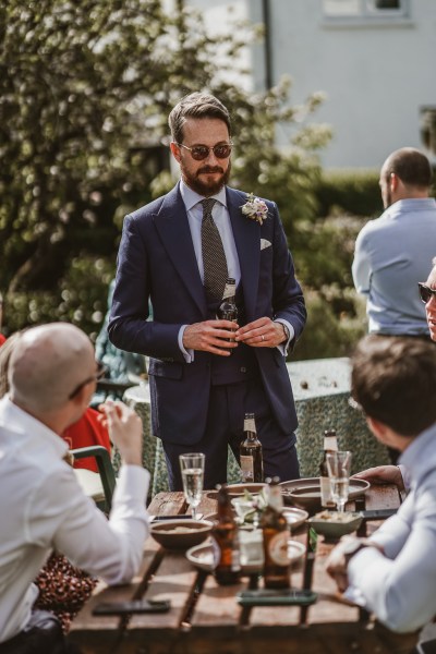 Groom and guests at table