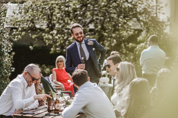 Groom and guests at table