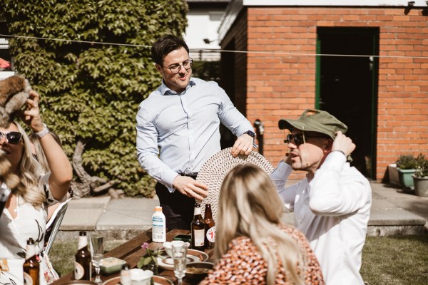 Guests family members chat and laugh