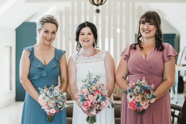 Bride and bridesmaids pose