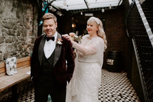 Bride up to surprise groom taps him on the shoulder