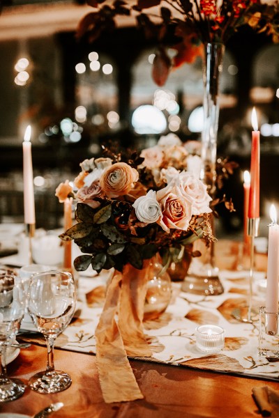 Flowers roses on table candles lighting