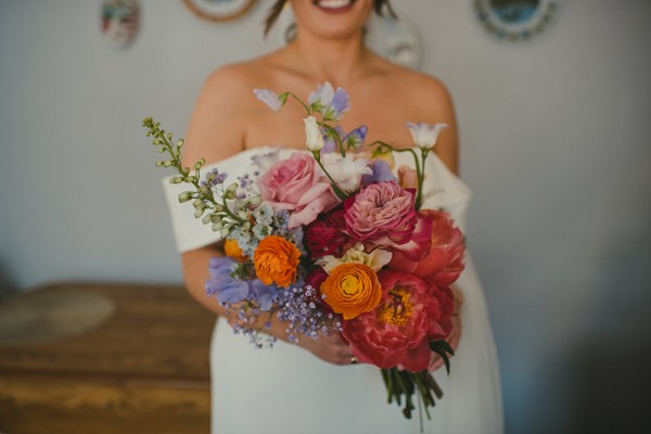 Bouquet flowers/roses close up and bride smiling