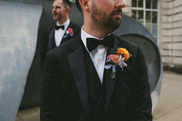 shot of groom and groomsmen looking away