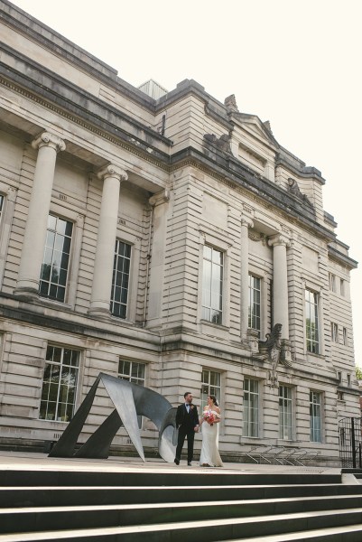 Exterior wedding venue and bride and groom