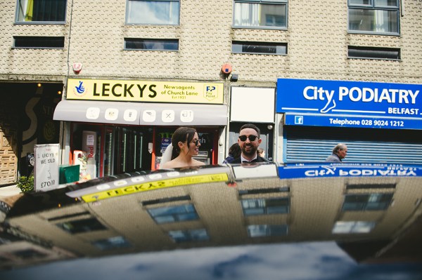 Leckys sign bride and groom car reflection