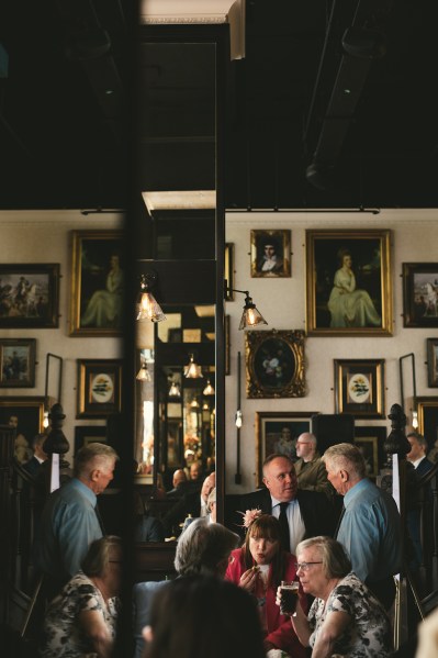 Interior pub setting crowd guests