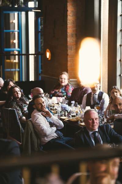 Group shot guests seated at dining table