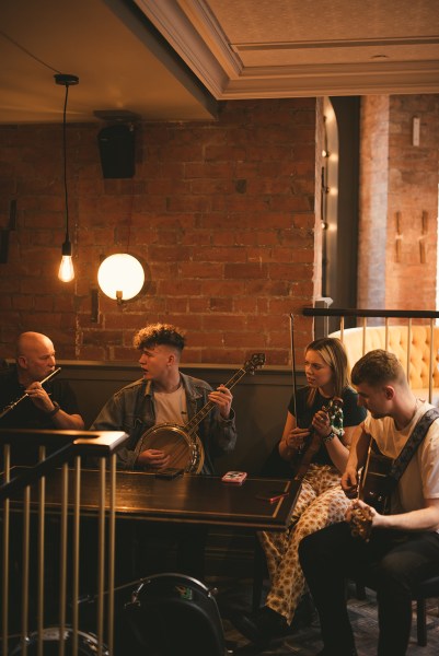 Wedding band playing songs in pub guitarist singer singing