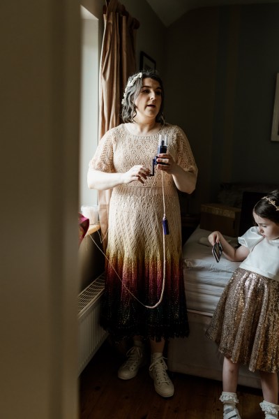 Bride puts on perfume