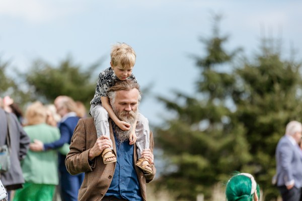 Man carries his son on his shoulder