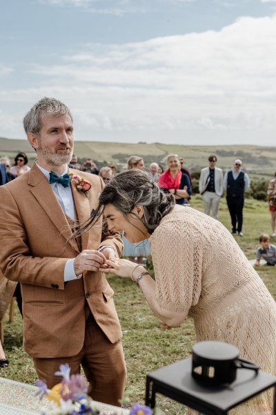 Bride and groom laugh at alter