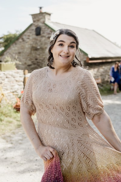 Bride walks along farm pathway posing poses