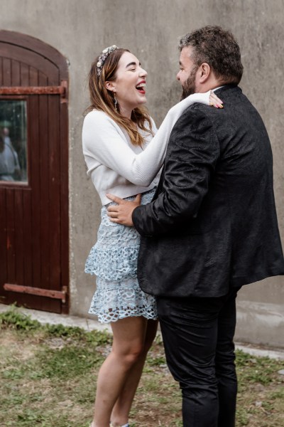 Man and woman smiling cheering laughing