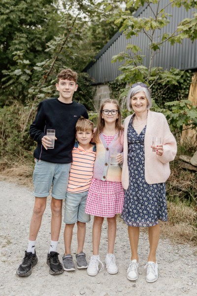 Family grandmother and children boy and two girls