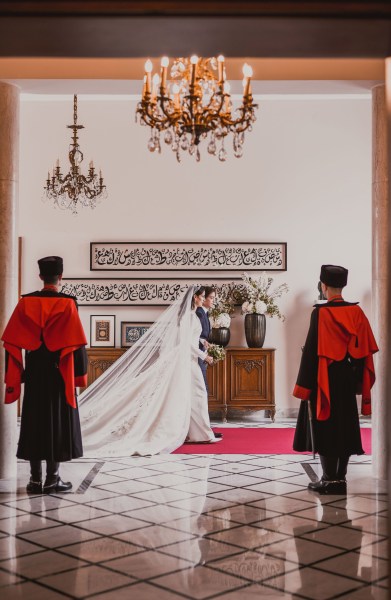 Jordanian Prince Hashem bin Abdullah (C-Back), the chaperone, walking with Princess Rajwa Al Saif (C-Front) of Saudi Arabia, on their way to the royal wedding ceremony of Jordanian Crown Prince Hussein