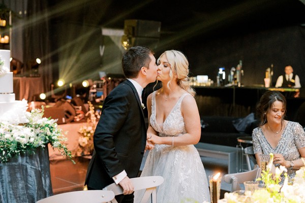 Bride and groom kiss kissing