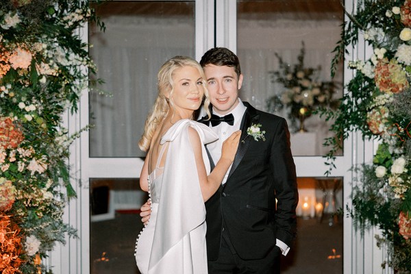 Bride and groom pose for a picture