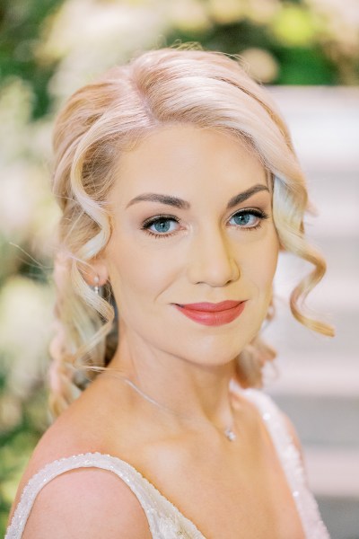 Bride looks at the camera and smile