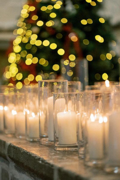 Christmas lights in background and candles lit