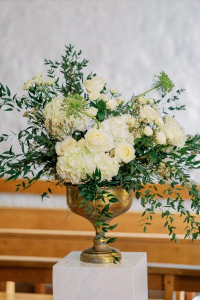 White flowers in golden vase