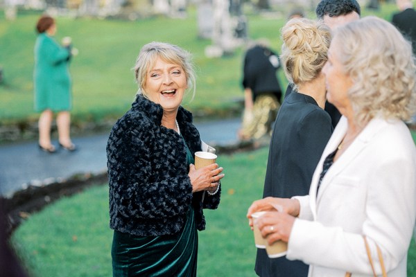 Woman wearing black dress smiles