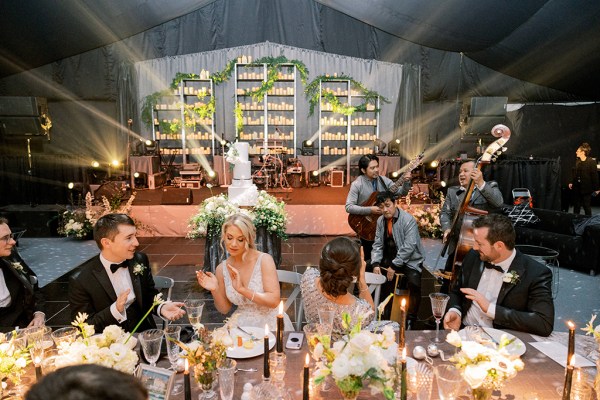 Bride groom and guests seated in dining room