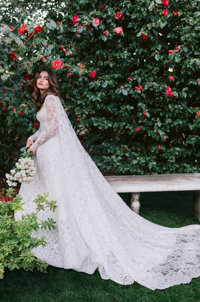 Monique Lhuillier Spring 2024 Collection bride long train dress apples in background garden setting