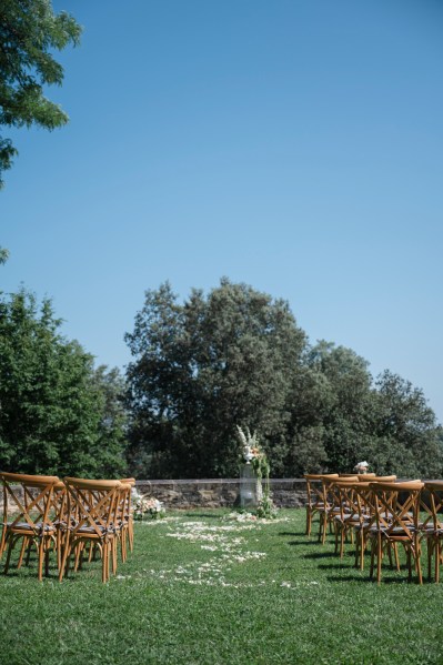 Ceremony setting chairs scenery mountains in background trees