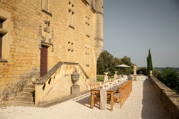 Exterior wedding venue and table setting for guests