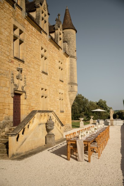 Exterior wedding venue and table setting for guests