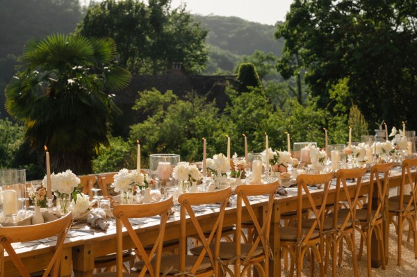 Table setting with trees and mountain view in background chairs