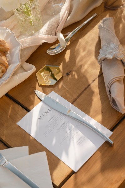 Wooden table name cards material cutlery serviettes and letter