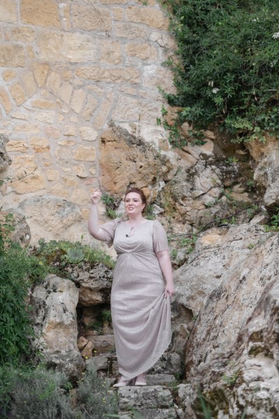 Joyous bridesmaids gestures to audience and guests